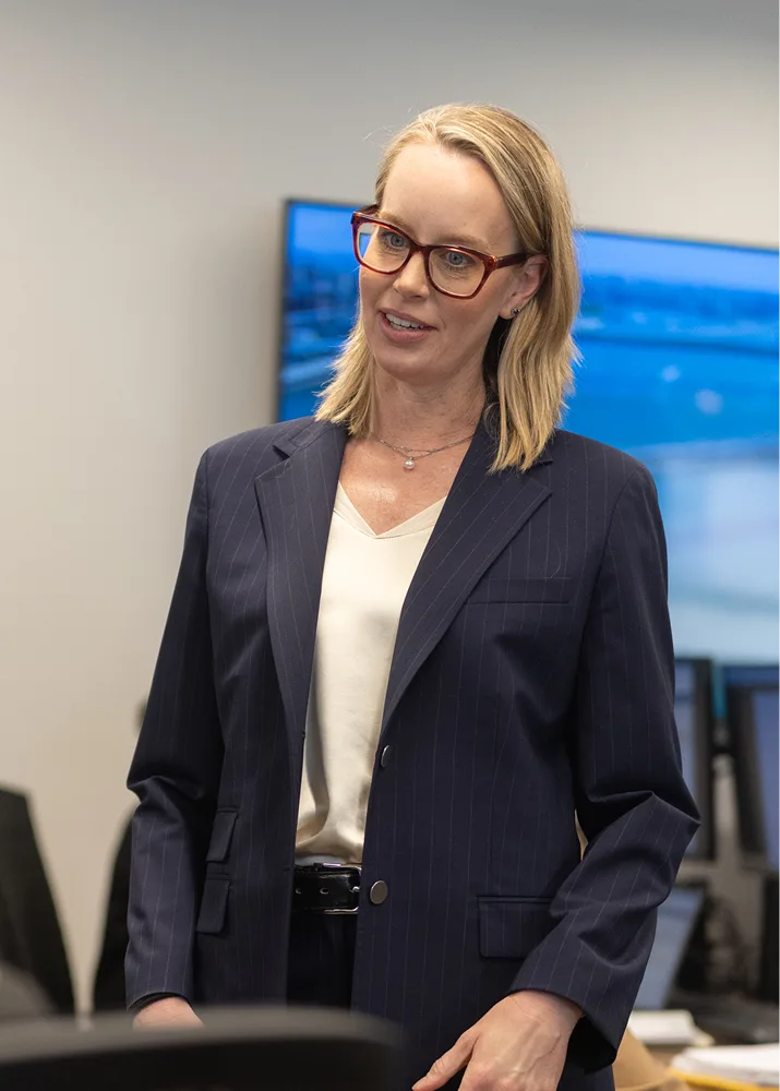 A professional speaking openly in an office setting.